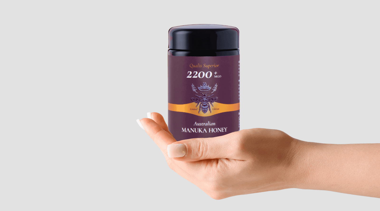 Lady holding jar showing off Manuka honey benefits