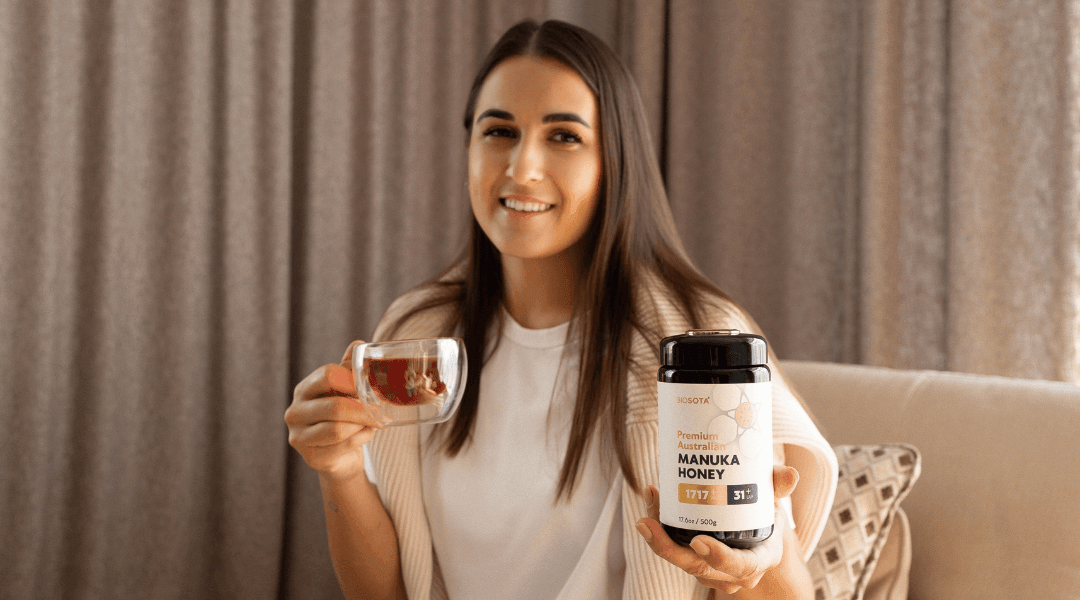 Woman showing how to use Manuka honey in a cup of tea